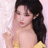 Li Keyi in a yellow off-shoulder outfit against a pink background, an official profile photograph